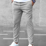 Męskie spodnie slim fit ze sznurkiem w pasie – zwężany krój – Szary